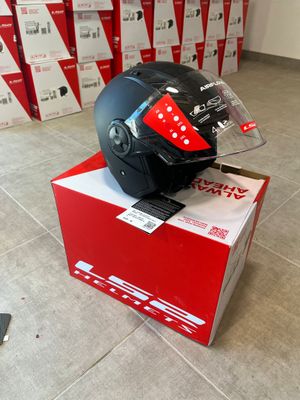 a helmet sitting on top of a box on the floor