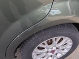 a close up of a car ' s tire on the street