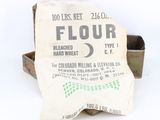 a bag of flour sitting next to a box of flour