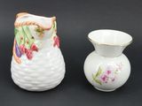 two vases sitting next to each other on a table