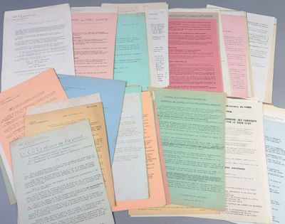 several papers are stacked on top of each other on a table