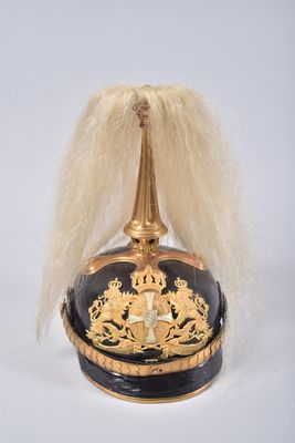 a black and gold hat with a gold crown on it