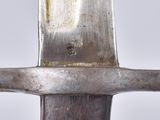 a close up of a knife with a metal handle
