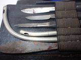 four knives and a knife sharper on a piece of leather