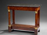 an antique console table with a marble top and brass accents