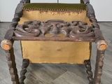 a wooden bench with a yellow seat on it