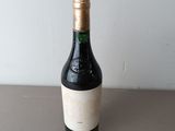 a bottle of wine that is sitting on a table