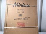 a cardboard box with a sticker on it sitting on a table
