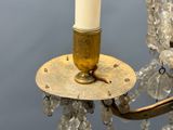 a candle that is sitting on a chandelier
