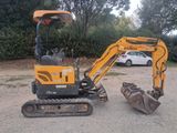 a small excavator that is sitting in the dirt