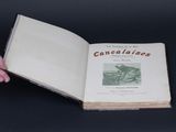 someone is holding a book open to a page with a picture of a man riding a bike