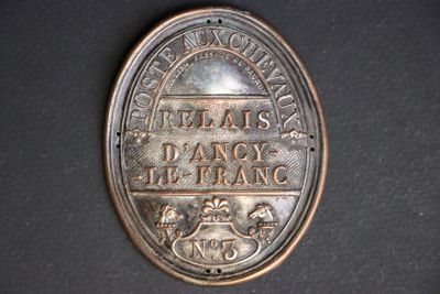 a close up of a medal on a black surface
