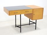 a small desk with a drawer on top of it