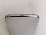 a close up of the back of a silver iphone