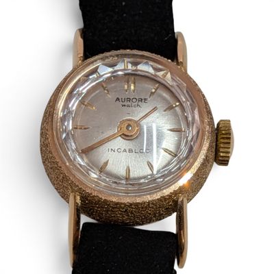 an image of a close up of a watch on a white surface
