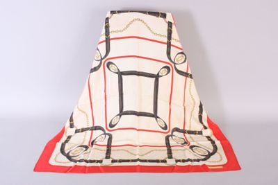 an image of a white and red blanket with chains on it