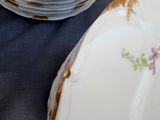 a lot of plates that are sitting on a table