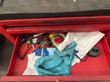 a red tool box with a lot of tools inside of it