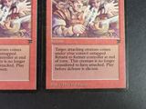 two cards that are sitting on a table