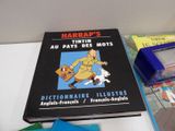 a book that is sitting on a table next to other books