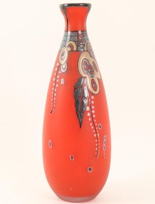a red vase with a design on it on a white background