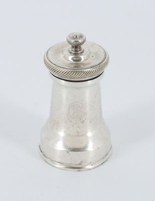 an antique silver pepper shaker on a white background