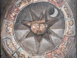 une peinture représentant le soleil et la lune dans un cercle