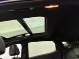 a view of the sunroof from inside of a car