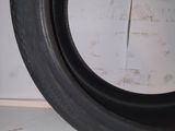 a close up of a tire tire on a white surface