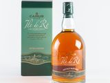 an image of a bottle of whisky next to a box