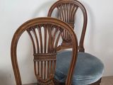 three chairs with blue velvet upholstered on them in a room