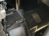 an air conditioner with a blower and a fan on top of it
