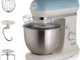 an image of a mixer with a bowl and a whisk attachment