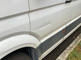 a white van that is parked in a parking lot