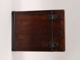 a small wooden box that is hanging on the wall