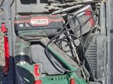 a box with tools in it sitting on the ground