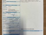 someone is filling out a tax form on a table