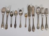 a lot of silver spoons and spoon spoons on a table