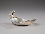 an image of a silver spoon with a bird on it