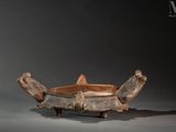 a wooden bowl that has a turtle on it