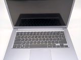 a silver laptop with a black keyboard on a table