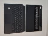 two laptops sitting side by side on a white surface