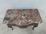 an image of a table with a marble top sitting on a tile floor