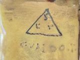 a close up of a glass plate with a triangle on it