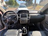 the interior of a car with a steering wheel, dashboard, and dashboard controls