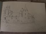 drawing of a castle in a book with a pencil on the pages