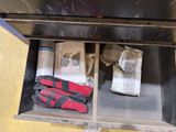 a box with gloves, gloves, and a pair of gloves in it