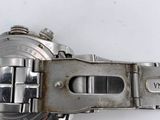 an image of a close up of a watch on a white surface