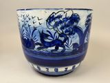 a blue and white bowl sitting on a table
