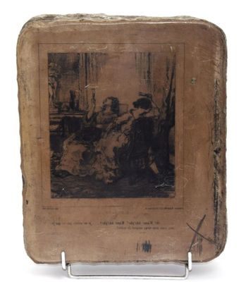 un vieux livre sur lequel figure la photo d'un homme et d'une femme assis sur un canapé